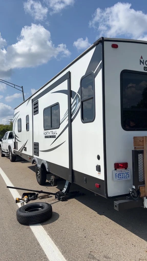 RV trailer during roadside tire service