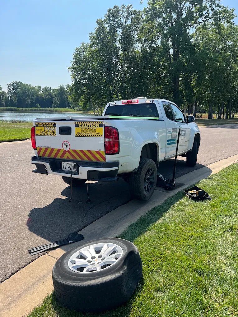 White pickup during roadside tire service